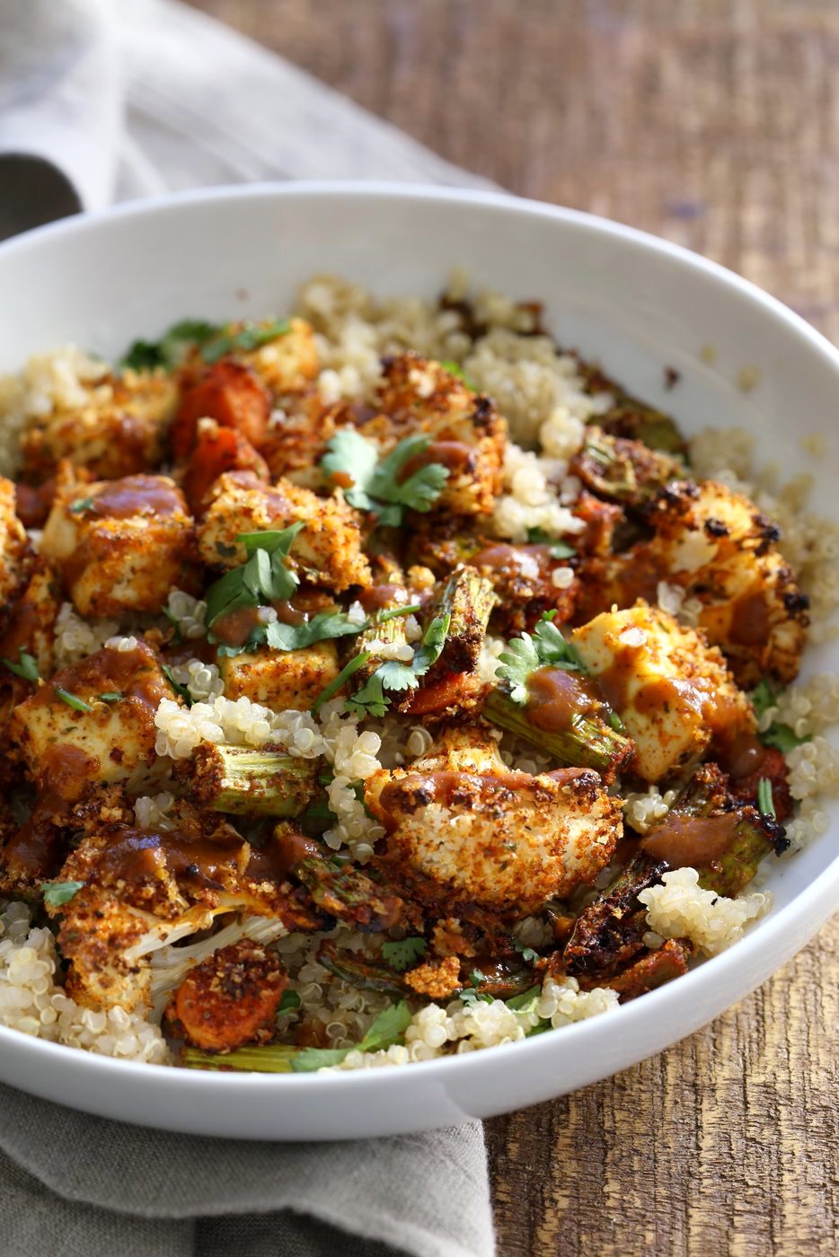 Tofu and Veggie BBQ Bowl. Veggies and Tofu tossed in from scratch barbecue seasoning and baked. Serve over quinoa dressed with bbq sauce. #Vegan #Glutenfree #Nutfree #Recipe #veganricha