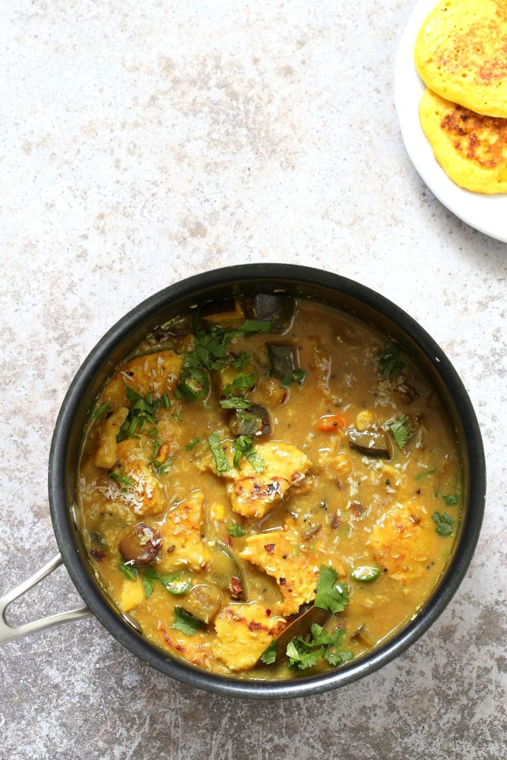 Lentil Fritters in Eggplant, Sweet Potato Coconut Stew - Bengali Inspired Chapor Ghonto. Indian Veggie Stew with Moong Dal patties. #Vegan #Glutenfree #Indian #Recipe #veganricha | VeganRicha.com