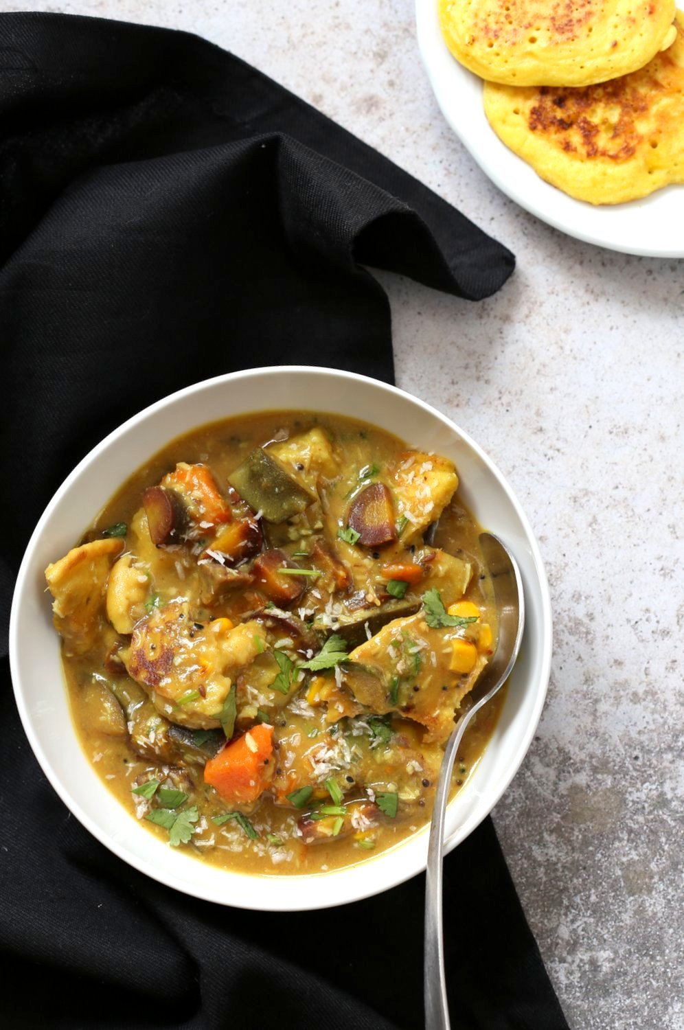 Lentil Fritters in Eggplant, Sweet Potato Coconut Stew - Bengali Inspired Chapor Ghonto. Indian Veggie Stew with Moong Dal patties. #Vegan #Glutenfree #Indian #Recipe #veganricha | VeganRicha.com