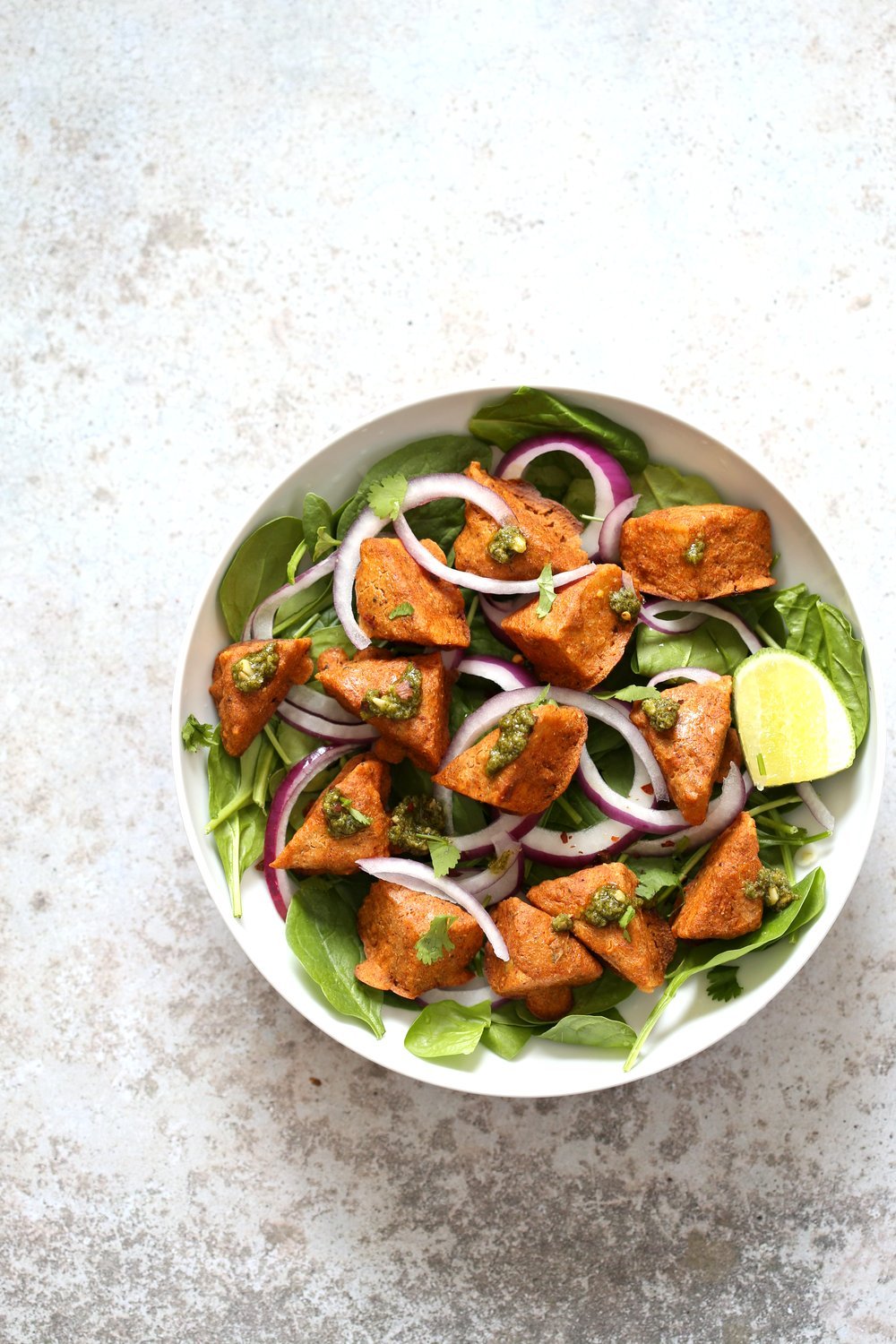 Tempeh Tandoori Tikka Bowl with Cilantro Mint Chutney. Tempeh marinated in Delicious and Flavorful Tandoori Marinade, then baked and served over greens, onions. #veganricha #Vegan #Glutenfree #Recipe. Use vegan meat subs for #soyfree | VeganRicha.com
