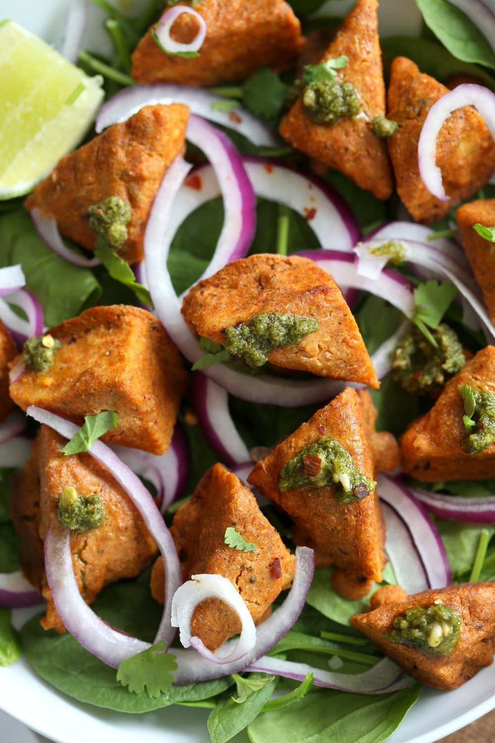 Tempeh Tandoori Kebab Tikka Bowl with Cilantro Mint Chutney. 25 Gm of Protein. Tempeh marinated in Delicious and Flavorful Tandoori Marinade, then baked and served over greens, onions. #veganricha #Vegan #Glutenfree #Recipe. Use Veggies or vegan meat subs for #soyfree | VeganRicha.com