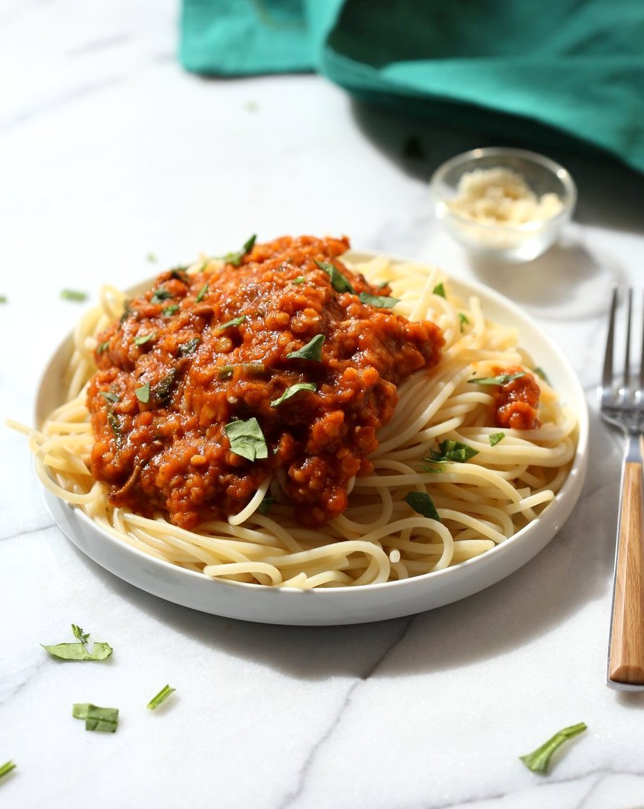 This Lentil Bolognese Sauce is hearty with Red lentils and Mushrooms and great with Spaghetti or other pasta. #Vegan #Soyfree #Nutfree #Recipe #VeganRicha. Can be gluten-free with #glutenfree #pasta | VeganRicha.com