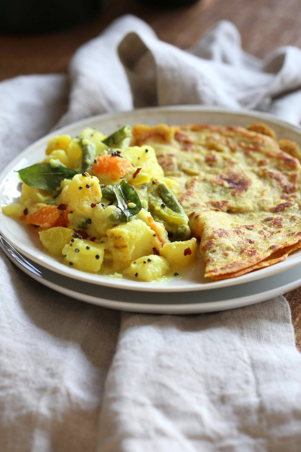 Avial - South Indian Veggie Coconut Curry. Seasonal Vegetables in easy spiced coconut sauce. Serve over rice, flatbread or dosa crepes. #Vegan #Indian #Glutenfree #Soyfree #Recipe #VEGANRICHA
