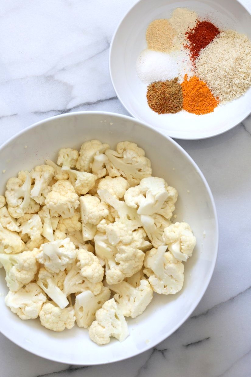 Cauliflower florets and Spices. Turmeric Roasted Cauliflower with Raita Dip. These Delicious Golden Cauliflower Bites are easy and quick. Serve with a dash of lemon or with a Yogurt onion dip or Green Chutney. #Vegan #Soyfree #Nutfree #veganricha #Recipe. Can be #glutenfree