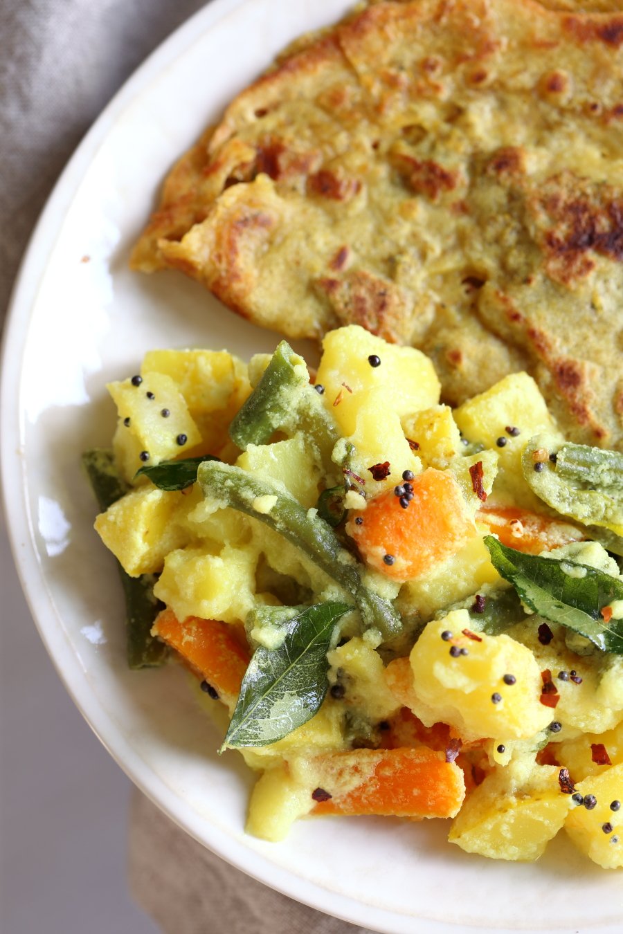 Avial - South Indian Veggie Coconut Curry. Seasonal Vegetables in easy spiced coconut sauce. Serve over rice, flatbread or dosa crepes. #Vegan #Indian #Glutenfree #Soyfree #Recipe #VeganRicha | VeganRicha.com