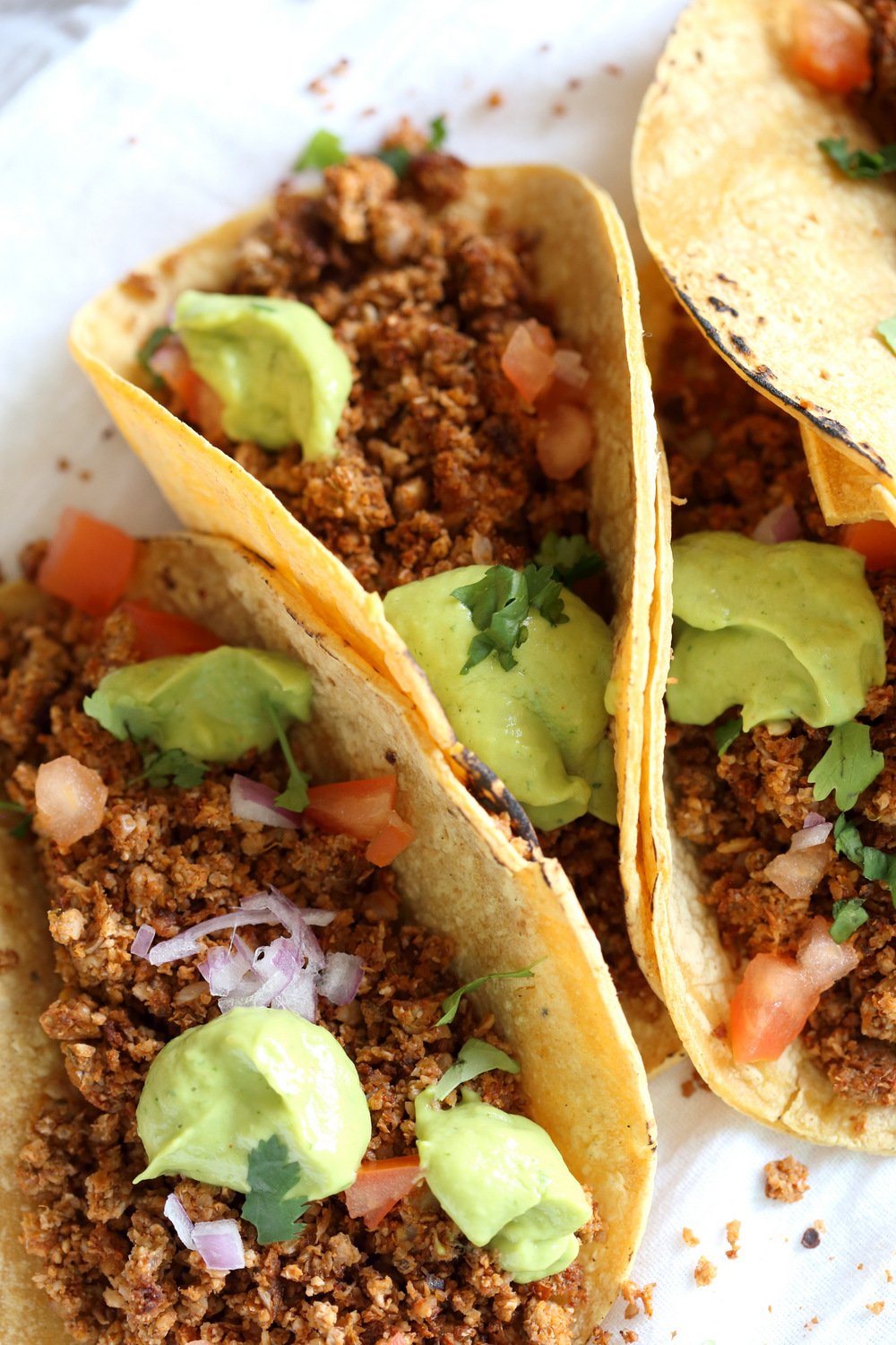 Cauliflower Taco Meat filled in Corn tortillas over White Napkin
