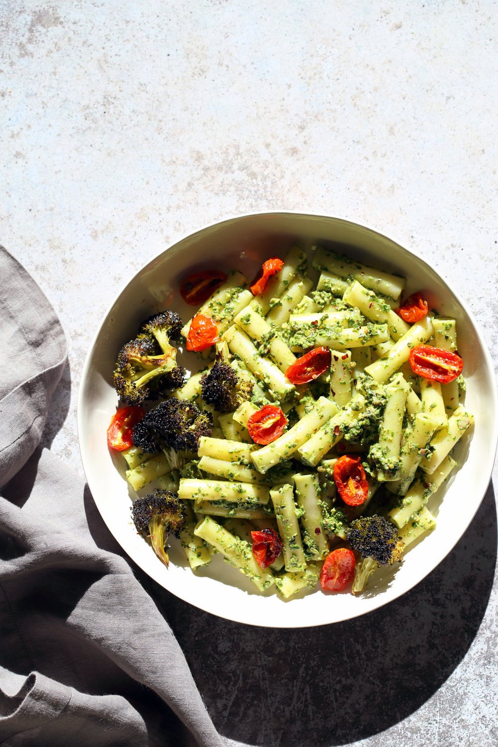 Vegan Pesto Pasta with Charred Broccoli. Easy Vegan Pesto with Ziti, served with roasted cherry tomatoes and roasted broccoli. 21 Gm of Protein #Vegan #Soyfree #Recipe #VeganRicha. Can be #glutenfree and #nutfree | VeganRicha.com