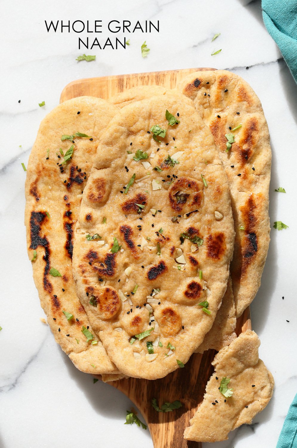 Vegan Wheat Naan Bread on a Wood Paddle