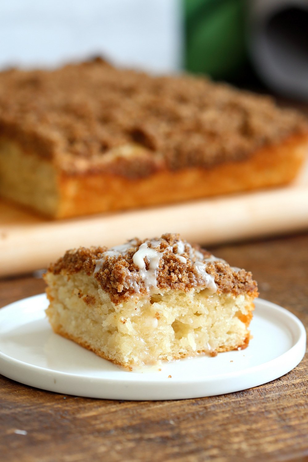 Vegan Coffee Cake on a small white plate on wood table
