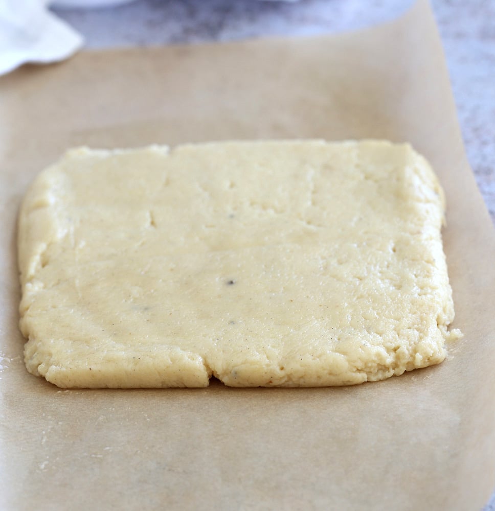 Making our Vegan Malai Burfi - Shaping burfi mixture onto parchment
