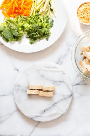 Assembly process of our vegan Fresh Spring rolls on marble