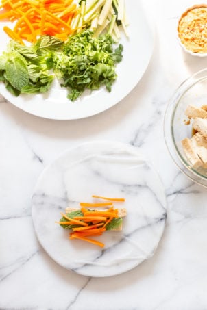 Assembly process of our vegan Fresh Spring rolls on marble