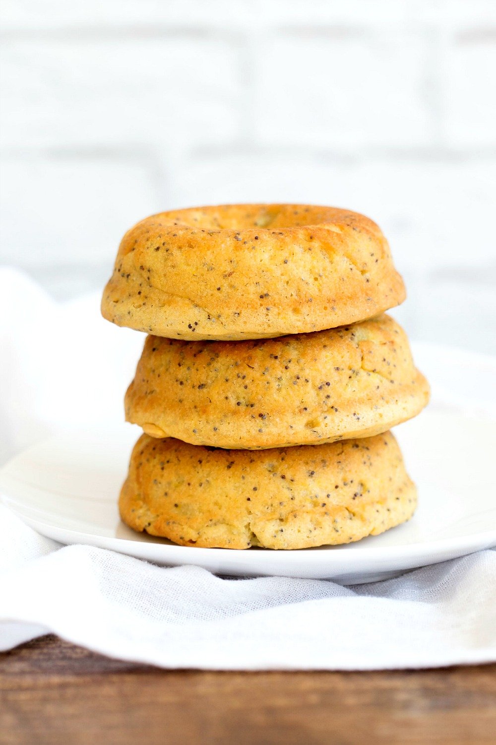 Lemon Poppy Seed Donuts - #Vegan Lemon Poppy Seed Donut Recipe. Simple to make and ready in less than 30 minutes. Top with cream cheese frosting. #VeganRicha #recipe #donuts