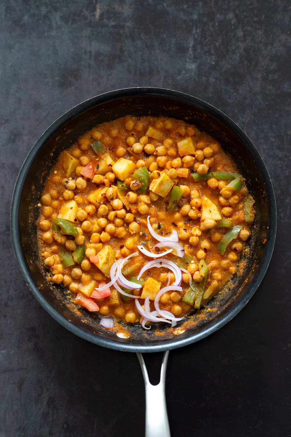 Kadai Chole is a delicious Chickpea curry generally made in wok. 1 Pot 30 min Spiced Chickpeas and Potatoes. Simple Indian sauce paired here with potatoes. #Vegan #Indian #Glutenfree #Soyfree #Nutfree #Recipe #indianvegan #VeganRicha