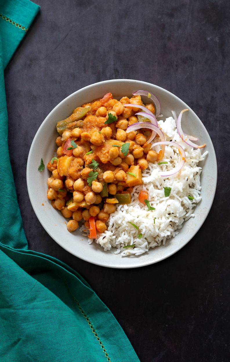 Kadai Chole is a delicious Chickpea curry generally made in wok. 1 Pot 30 min Spiced Chickpeas and Potatoes. Simple Indian sauce paired here with potatoes. #Vegan #Indian #Glutenfree #Soyfree #Nutfree #Recipe #indianvegan #VeganRicha