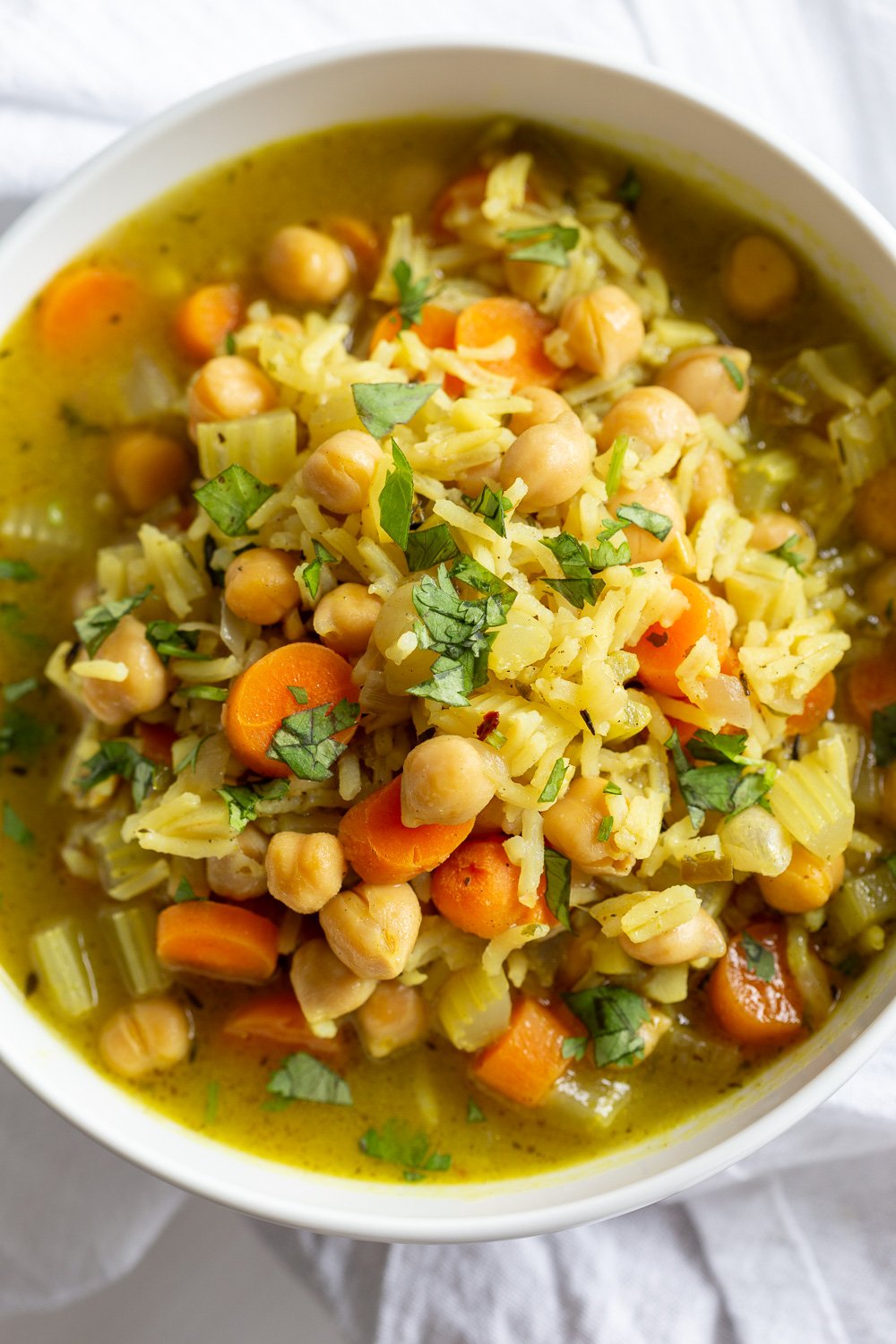 Comforting and Healing Vegan Chickpea Rice Soup with Veggies. A glutenfree variation of Vegan Chicken Noodle Soup. Easy 1 Pot 30 minute meal. #vegan #veganricha #Glutenfree #Nutfree #Recipe #Soyfreeoption