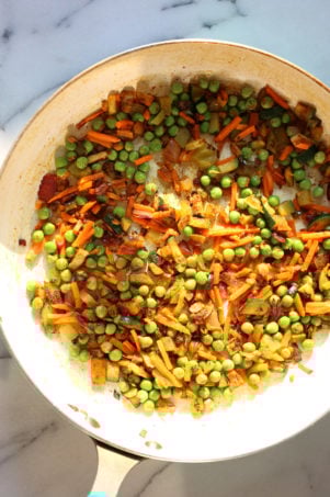 This Curry Fried Rice is packed full of flavor. Easy to make and gluten free. Use other cooked grains, spice blends for variation.  A perfect side or a light meal. #vegan #Glutenfree #Soyfree #Nutfree #Recipe #veganricha