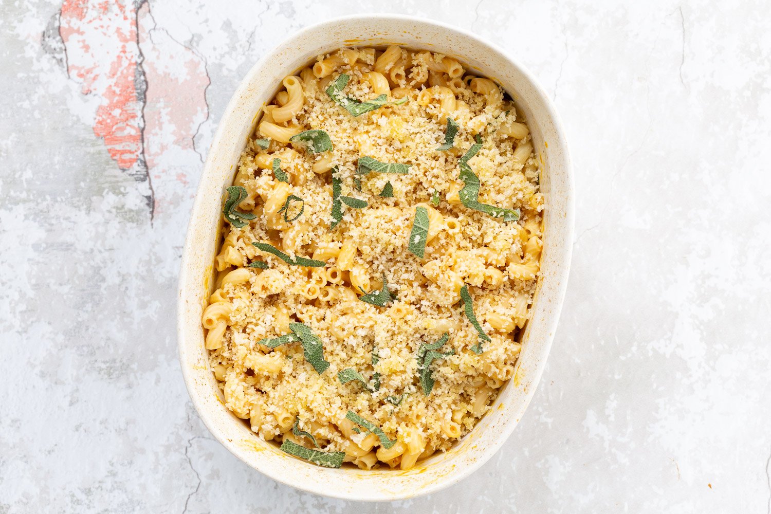 Vegan Pumpkin Mac and Cheese Bake. Easy Creamy Pumpkin Sauce with pasta, topped with crisp sage and breadcrumbs. #Vegan #Soyfree #Recipe #VeganRicha #nutfree option