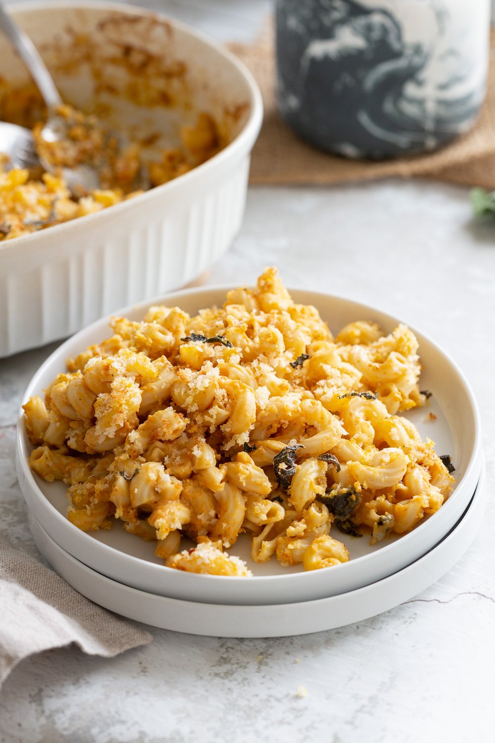 Vegan Pumpkin Mac and Cheese Bake. Easy Creamy Pumpkin Sauce with pasta, topped with crisp sage and breadcrumbs. #Vegan #Soyfree #Recipe #VeganRicha #nutfree option