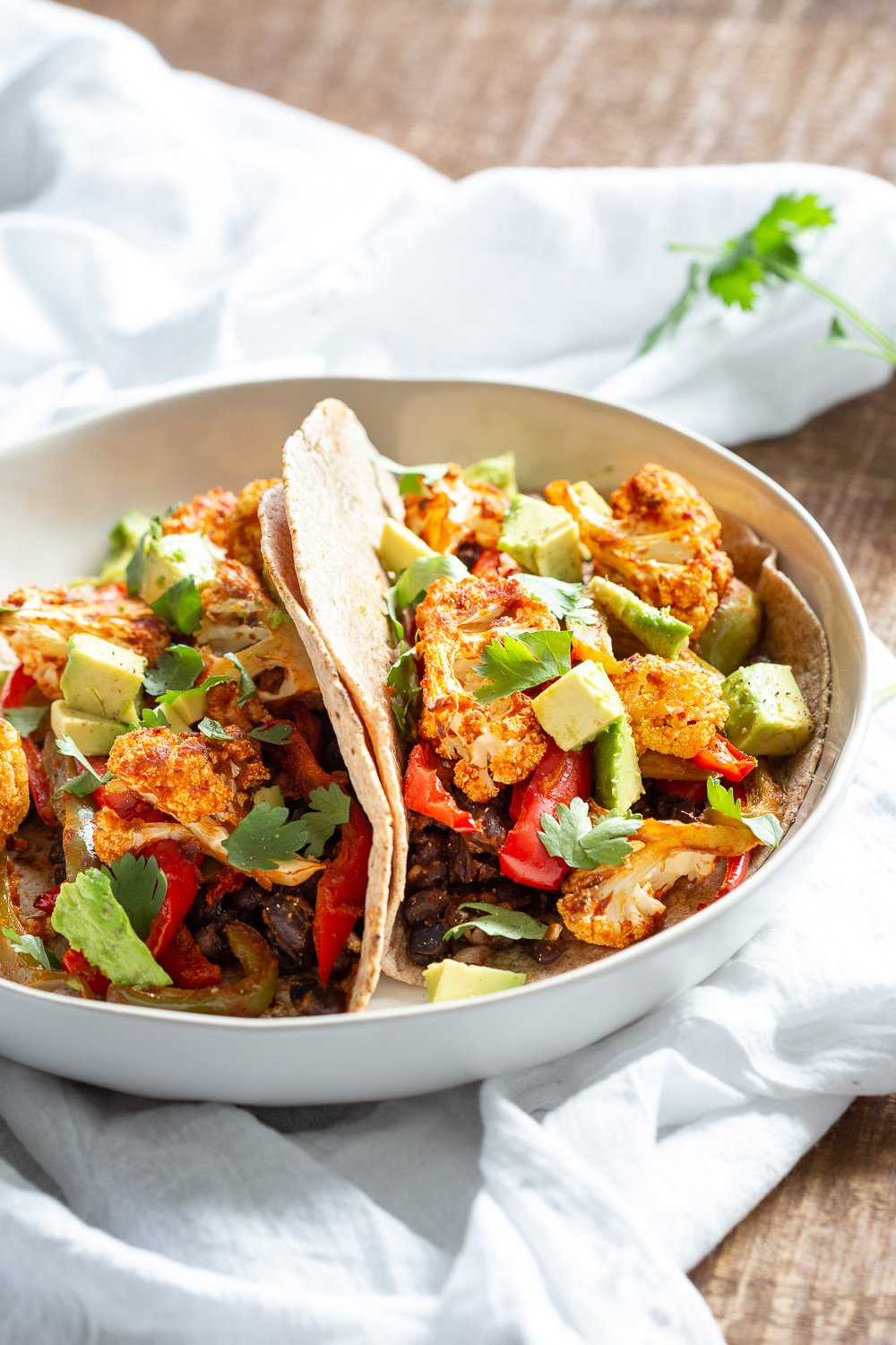 Sheet Pan Fajitas. Cauliflower, Peppers, Beans tossed in Chipotle Fajita Sauce and baked. Serve in tacos or Bowl #Vegan #Glutenfree #Soyfree Nutfree #Recipe #VeganRicha