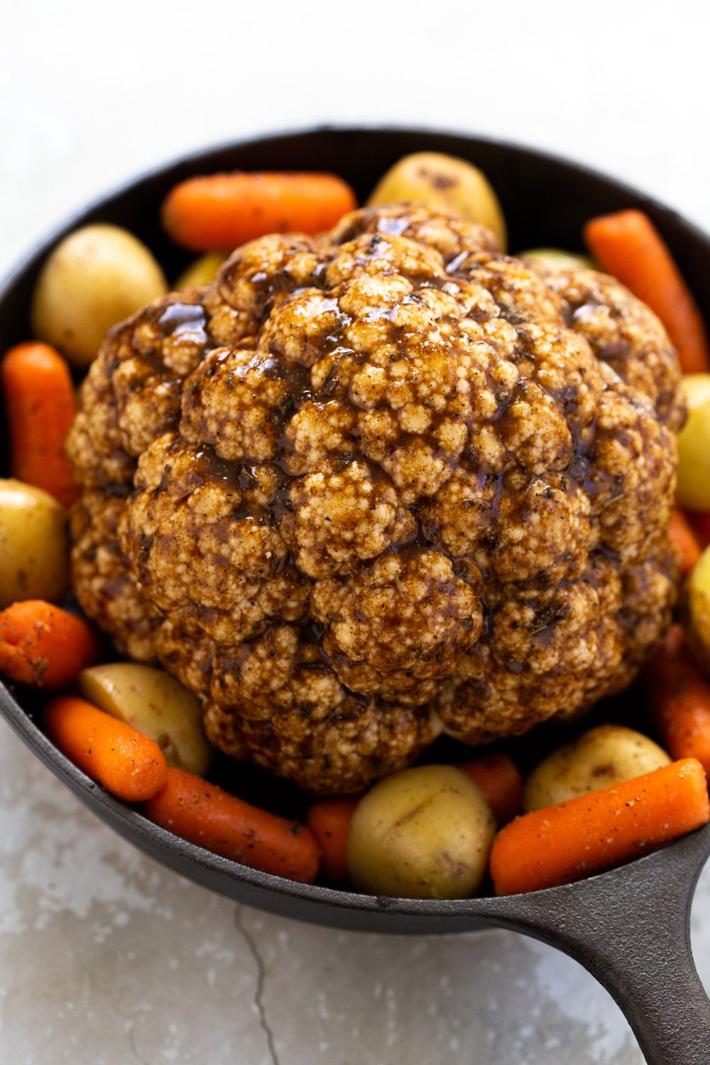 Whole Roasted Cauliflower. This Baked Whole Roasted Cauliflower is marinated in flavorful of herbs and spices and baked to perfection to make a fabulous Holiday table option. #VeganRicha #holiday #Vegan #Glutenfree #Nutfree #recipe. Can be #soyfree