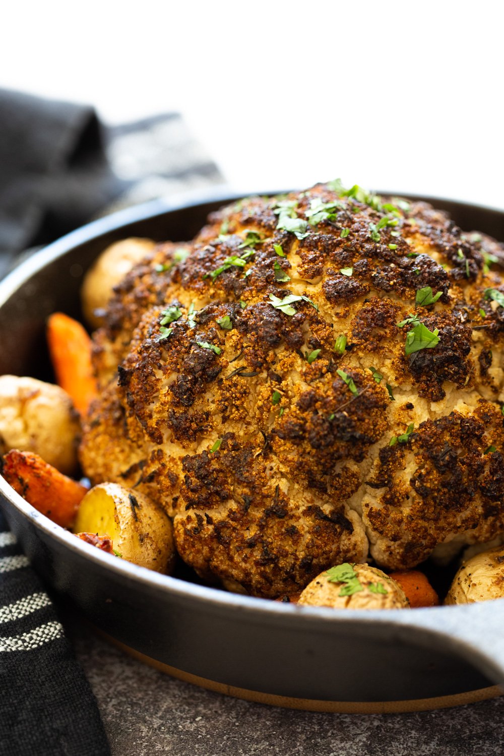 Whole Roasted Cauliflower. This Baked Whole Roasted Cauliflower is marinated in flavorful of herbs and spices and baked to perfection to make a fabulous Holiday table option. #VeganRicha #holiday #Vegan #Glutenfree #Nutfree #recipe. Can be #soyfree