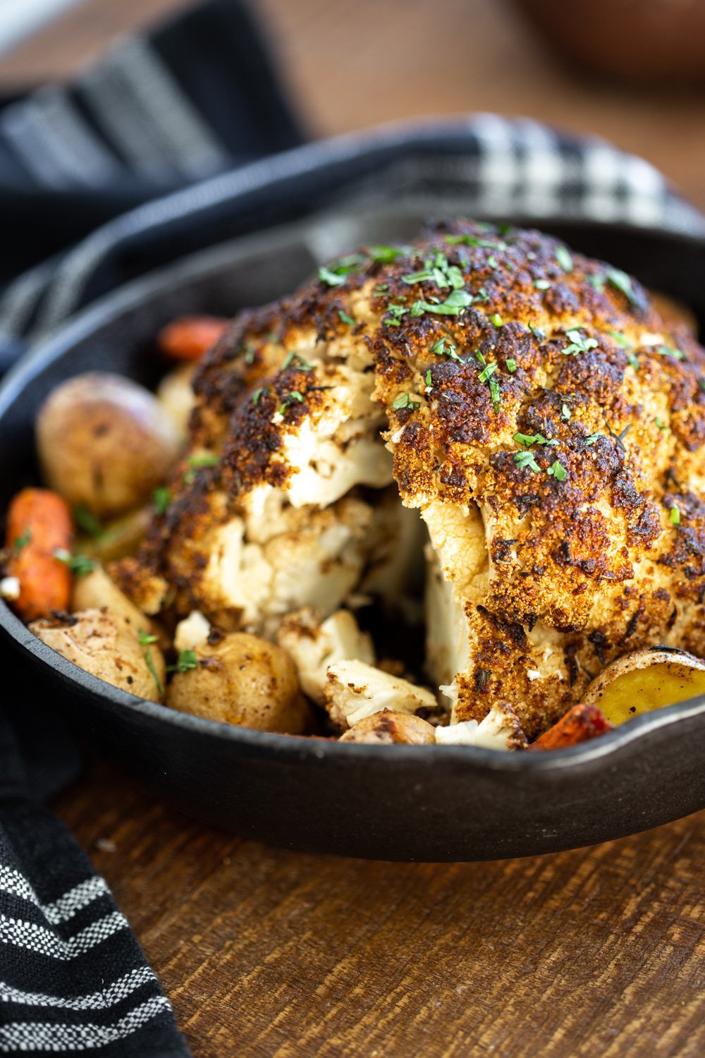 Whole Roasted Cauliflower. This Baked Whole Roasted Cauliflower is marinated in flavorful of herbs and spices and baked to perfection to make a fabulous Holiday table option. #VeganRicha #holiday #Vegan #Glutenfree #Nutfree #recipe. Can be #soyfree
