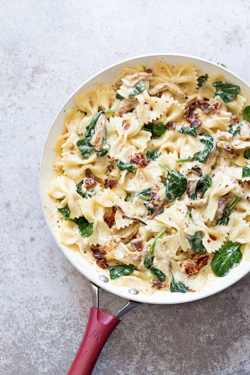 Creamy Sun dried Tomato Pasta in a white skillet