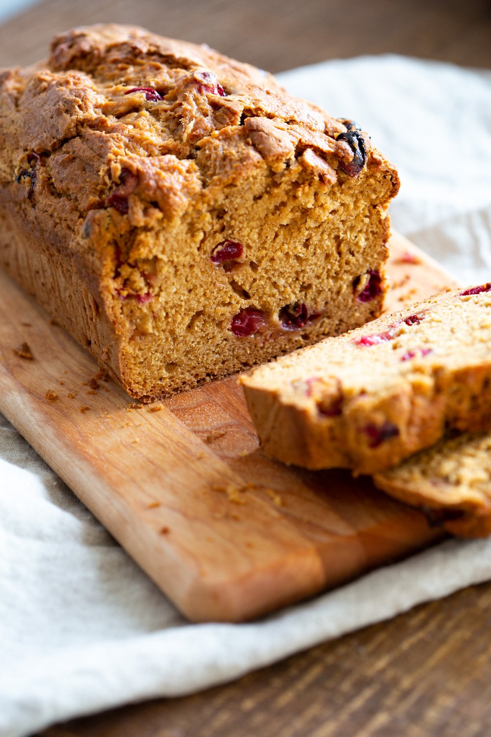 Vegan Sweet Potato Bread sliced on a wood cutting board