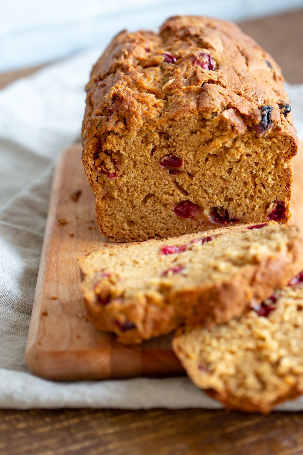 Vegan Sweet Potato Bread sliced on a wood cutting board