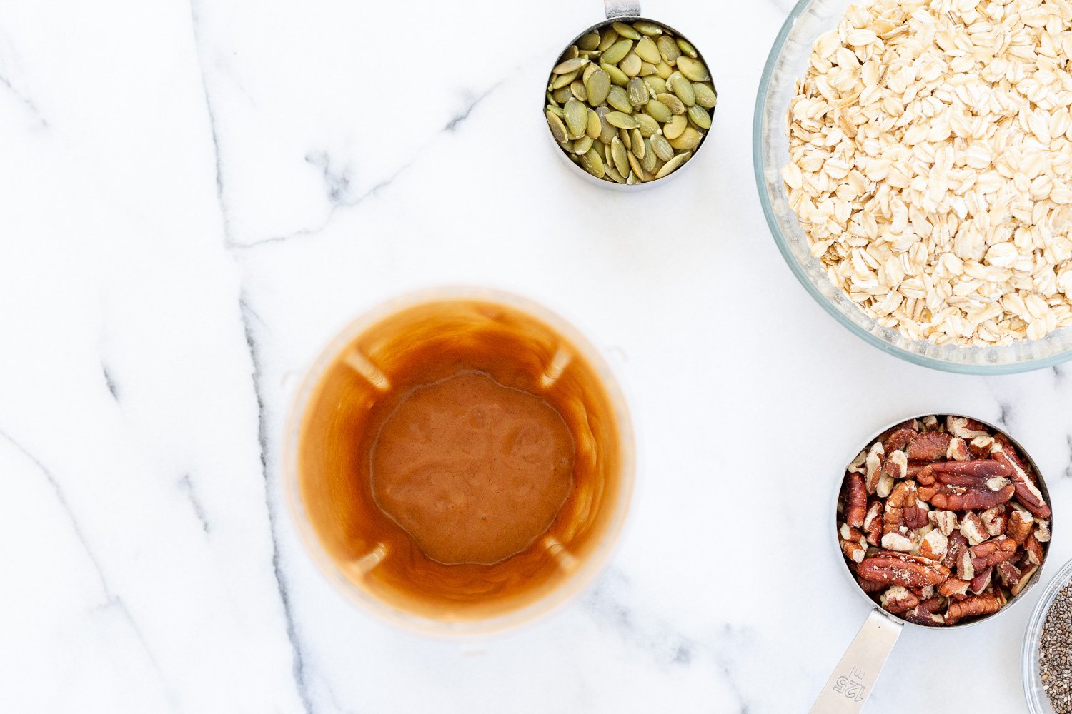 This Date Caramel Maple Pecan Granola is lightly sweet and perfect for any time. Pecans, Oats, coconut, pumpkin and chia seeds and dried blueberries tossed in date caramel and baked to perfection. #Vegan #Granola #Glutenfree #Soyfree #Recipe #VeganRicha Can be nutfree.