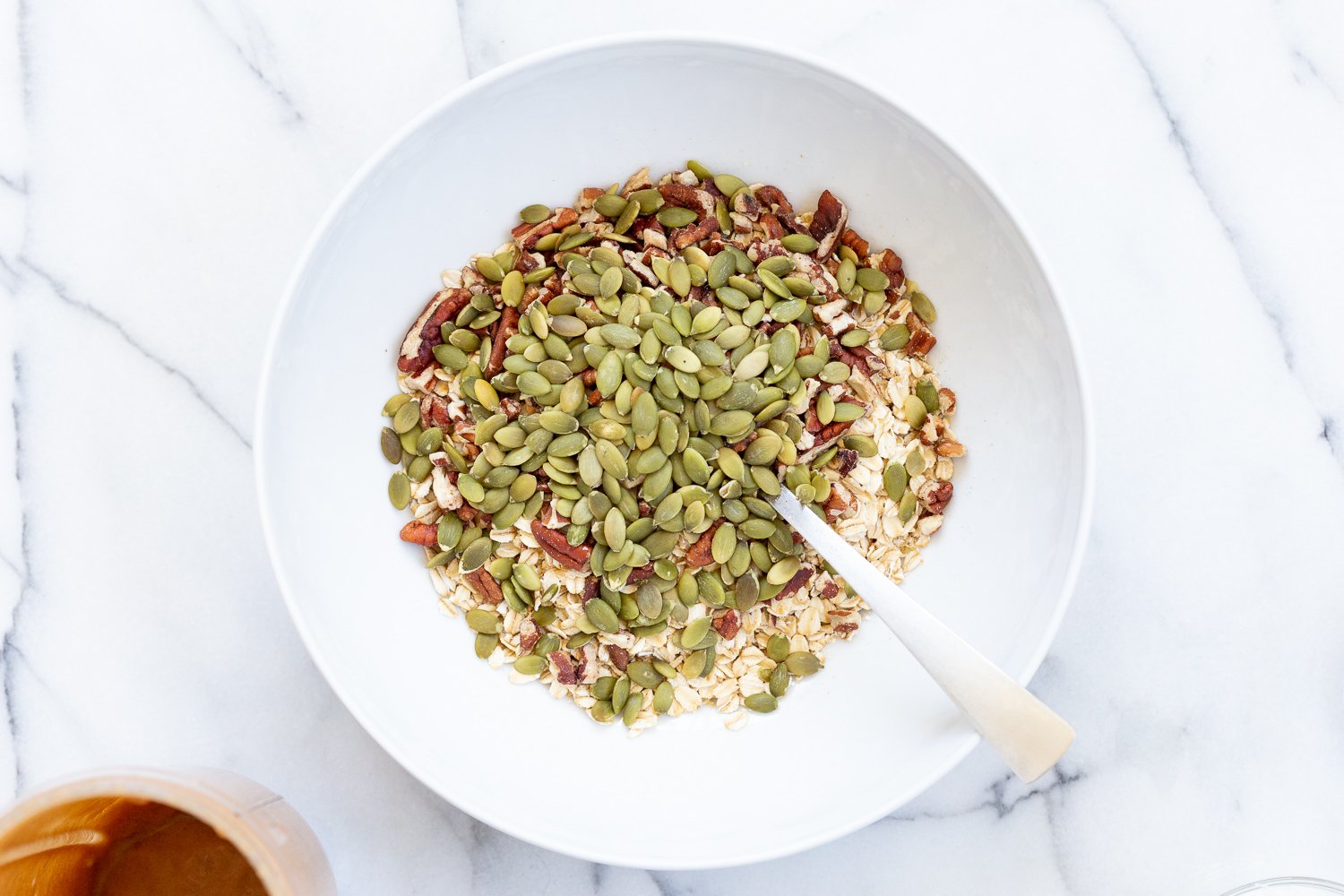 This Date Caramel Maple Pecan Granola is lightly sweet and perfect for any time. Pecans, Oats, coconut, pumpkin and chia seeds and dried blueberries tossed in date caramel and baked to perfection. #Vegan #Granola #Glutenfree #Soyfree #Recipe #VeganRicha Can be nutfree.