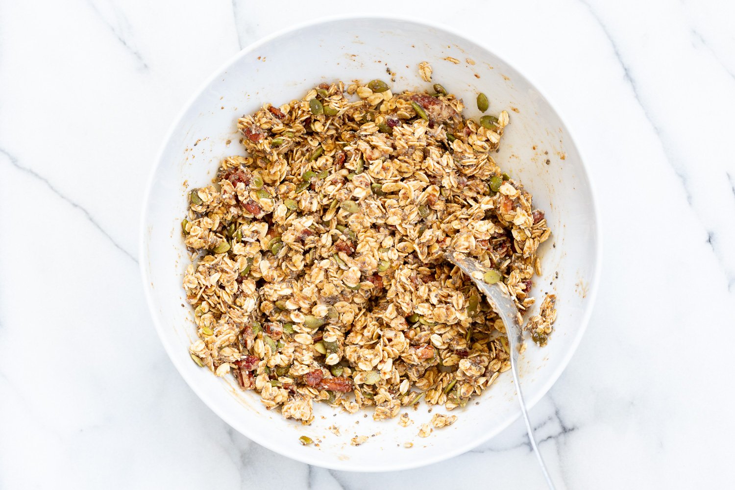 This Date Caramel Maple Pecan Granola is lightly sweet and perfect for any time. Pecans, Oats, coconut, pumpkin and chia seeds and dried blueberries tossed in date caramel and baked to perfection. #Vegan #Granola #Glutenfree #Soyfree #Recipe #VeganRicha Can be nutfree.