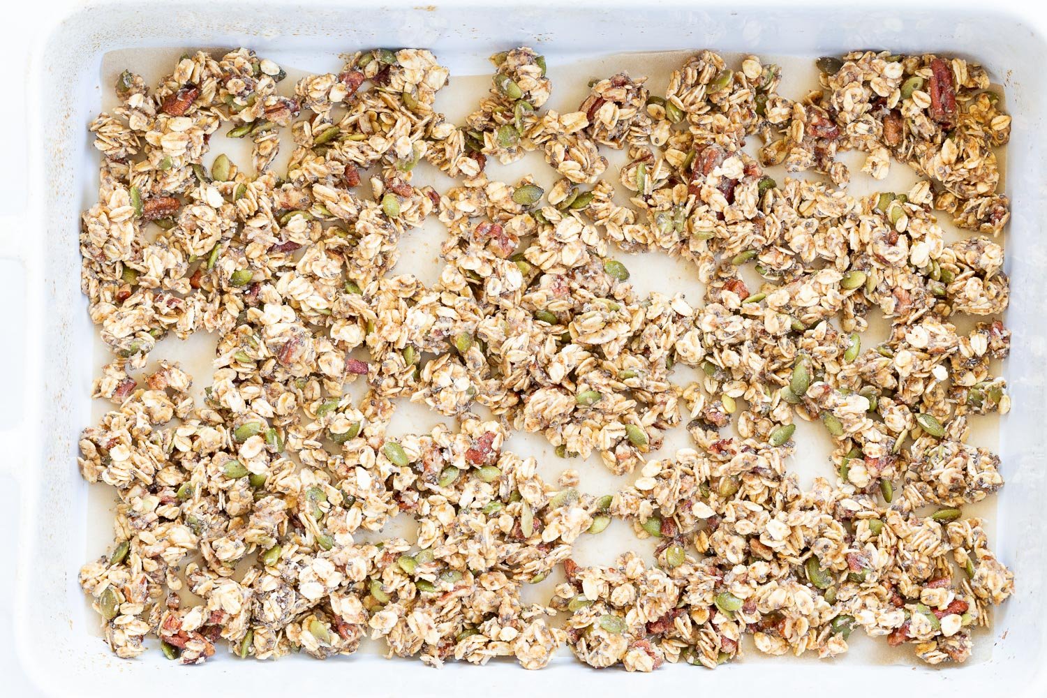 This Date Caramel Maple Pecan Granola is lightly sweet and perfect for any time. Pecans, Oats, coconut, pumpkin and chia seeds and dried blueberries tossed in date caramel and baked to perfection. #Vegan #Granola #Glutenfree #Soyfree #Recipe #VeganRicha Can be nutfree.