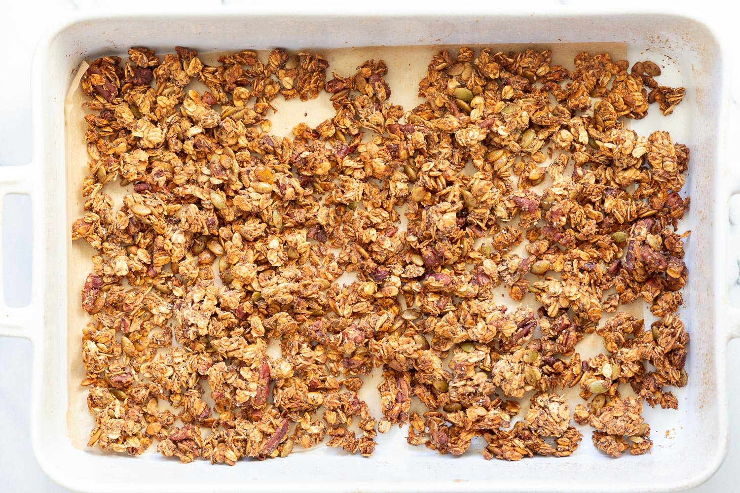 This Date Caramel Maple Pecan Granola is lightly sweet and perfect for any time. Pecans, Oats, coconut, pumpkin and chia seeds and dried blueberries tossed in date caramel and baked to perfection. #Vegan #Granola #Glutenfree #Soyfree #Recipe #VeganRicha Can be nutfree.