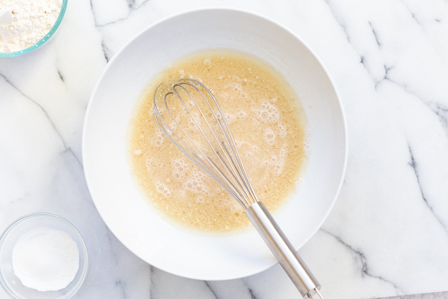 Cake batter for Our Vegan Pear Upside Down Cake in a white bowl