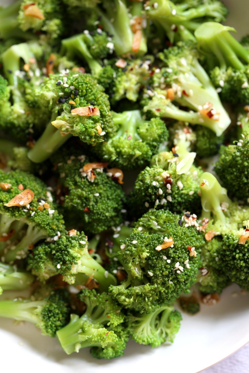 Sesame Garlic Broccoli needs just 6 ingredients. It is vibrant with blanched broccoli and delicious with a simple dressing of garlic roasted with sesame oil. A perfect side. Chinese garlic broccoli #Vegan #glutenfree #soyfreeoption #nutfree #veganricha #recipe