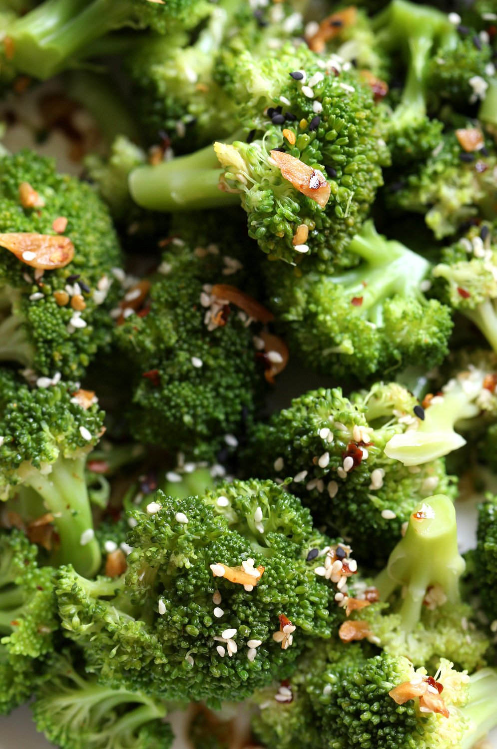 Sesame Garlic Broccoli needs just 6 ingredients. It is vibrant with blanched broccoli and delicious with a simple dressing of garlic roasted with sesame oil. A perfect side. #Vegan #glutenfree #soyfreeoption #nutfree #veganricha #recipe