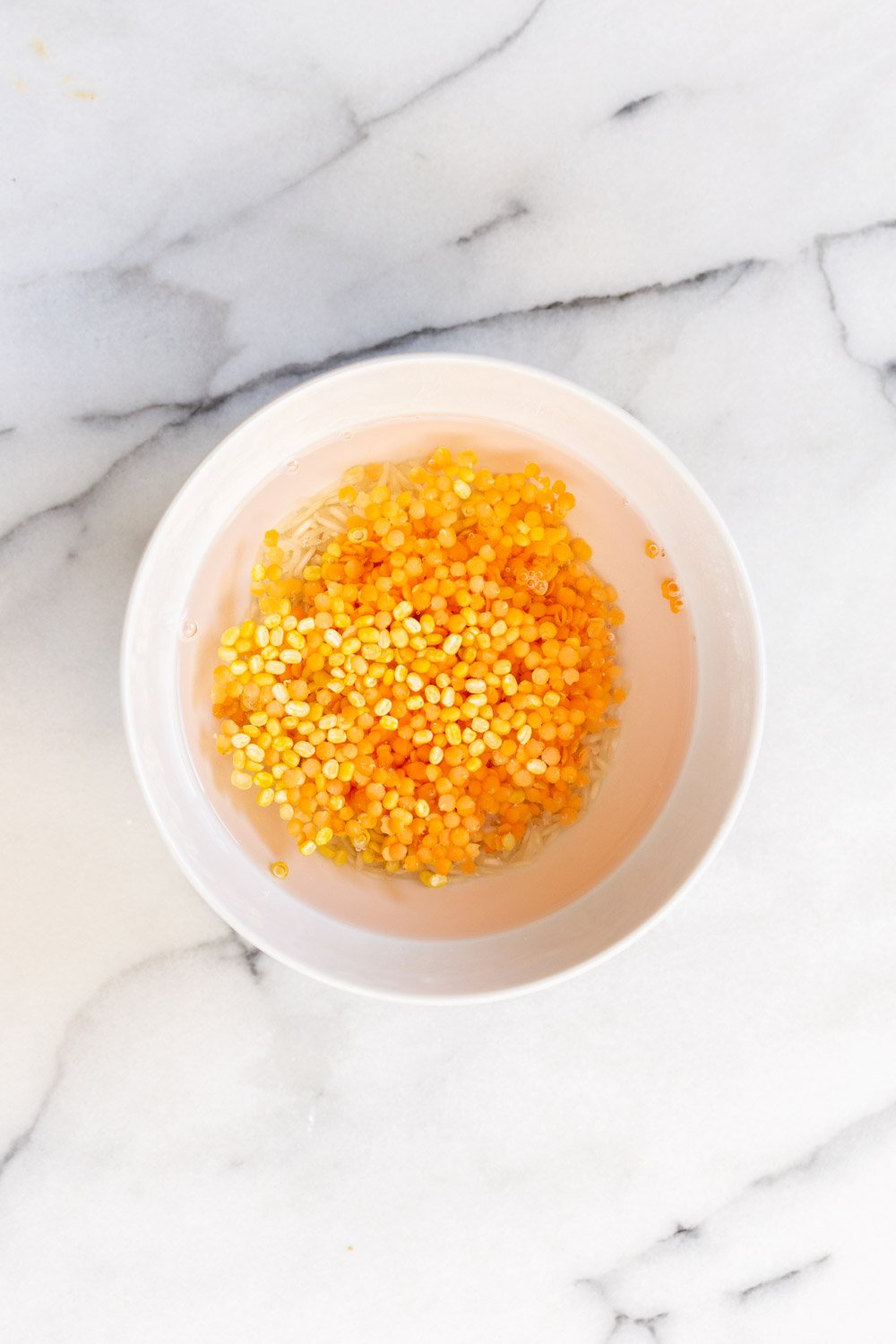 Instant Pot Kitchari red lentils and rice soaking in water