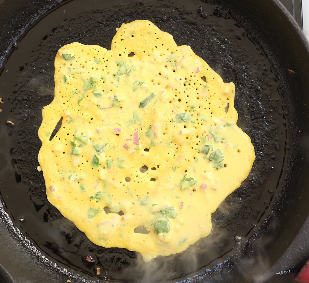 Vegan Chickpea Pancakes on a cast iron skillet