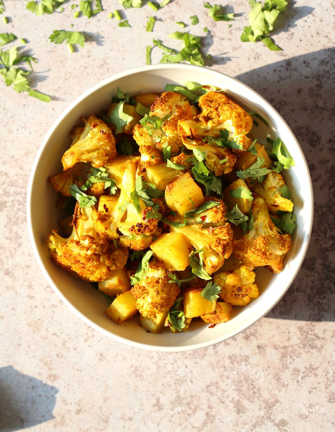 Baked Aloo Gobi - Indian Spiced Potato Cauliflower. 10 Mins Active. Toss with spices, put it to bake, and done! No Standing around, no Mushy Cauliflower! Same Amazing Indian flavor and excellent texture. Tips and options for Aloo Gobi Subzi that bakes perfectly every time! #Vegan #Glutenfree #Soyfree #Nutfree #VeganRicha #aloogobi #Recipe