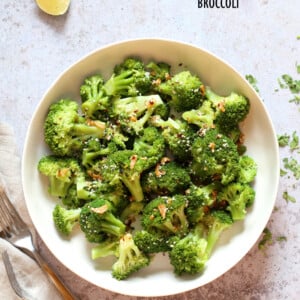 Sesame Garlic Broccoli needs just 6 ingredients. It is vibrant with blanched broccoli and delicious with a simple dressing of garlic roasted with sesame oil. A perfect side. #Vegan #glutenfree #soyfree #nutfree #veganricha #recipe 