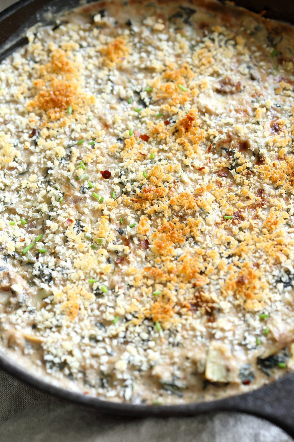 Vegan Spinach Artichoke Dip in a cast iron skillet