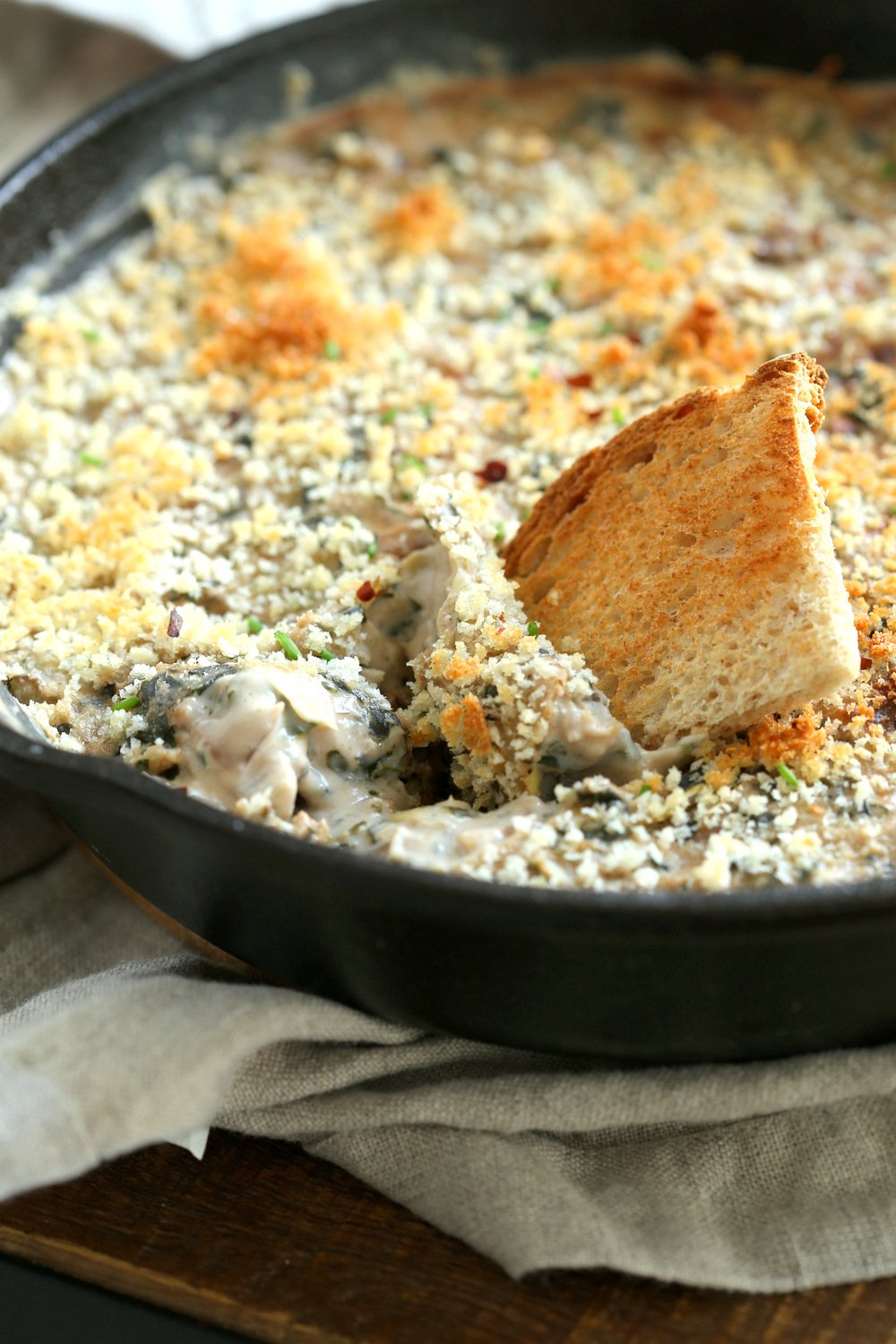 Vegan Spinach Artichoke Dip in a cast iron skillet