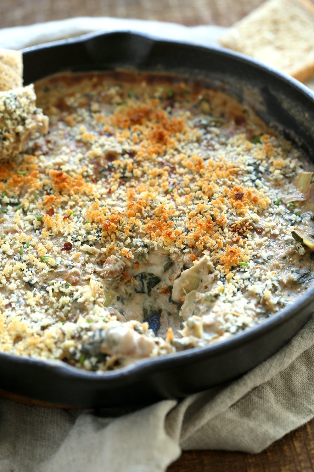our Vegan Spinach Artichoke Dip in a cast iron skillet