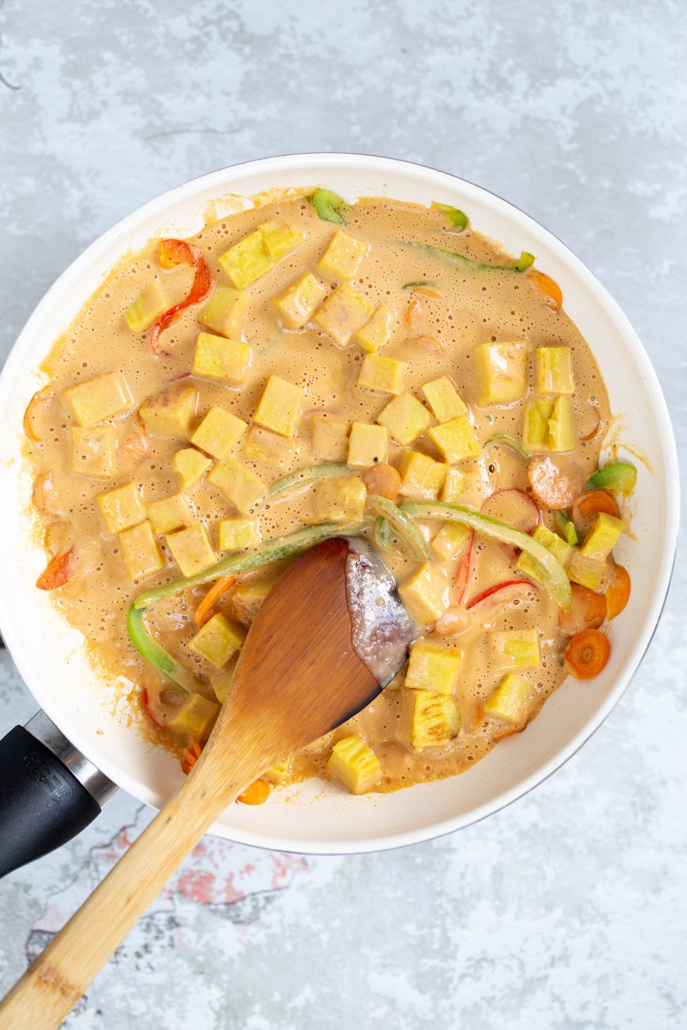 Soyfree Chickpea Tofu Stir fry with Sunbutter Sauce in a white skillet