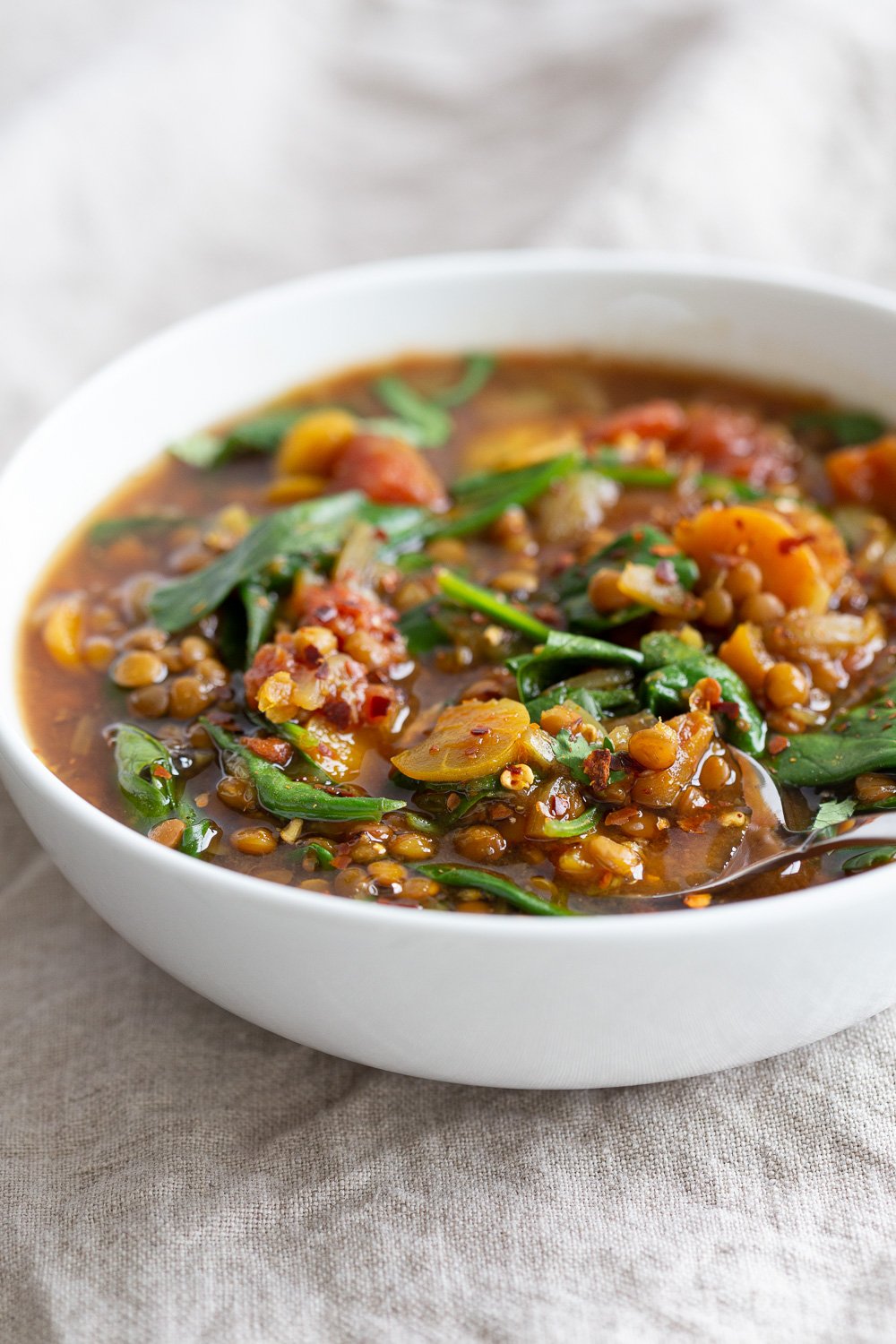 Our Vegan Lentil Soup in a white bowl