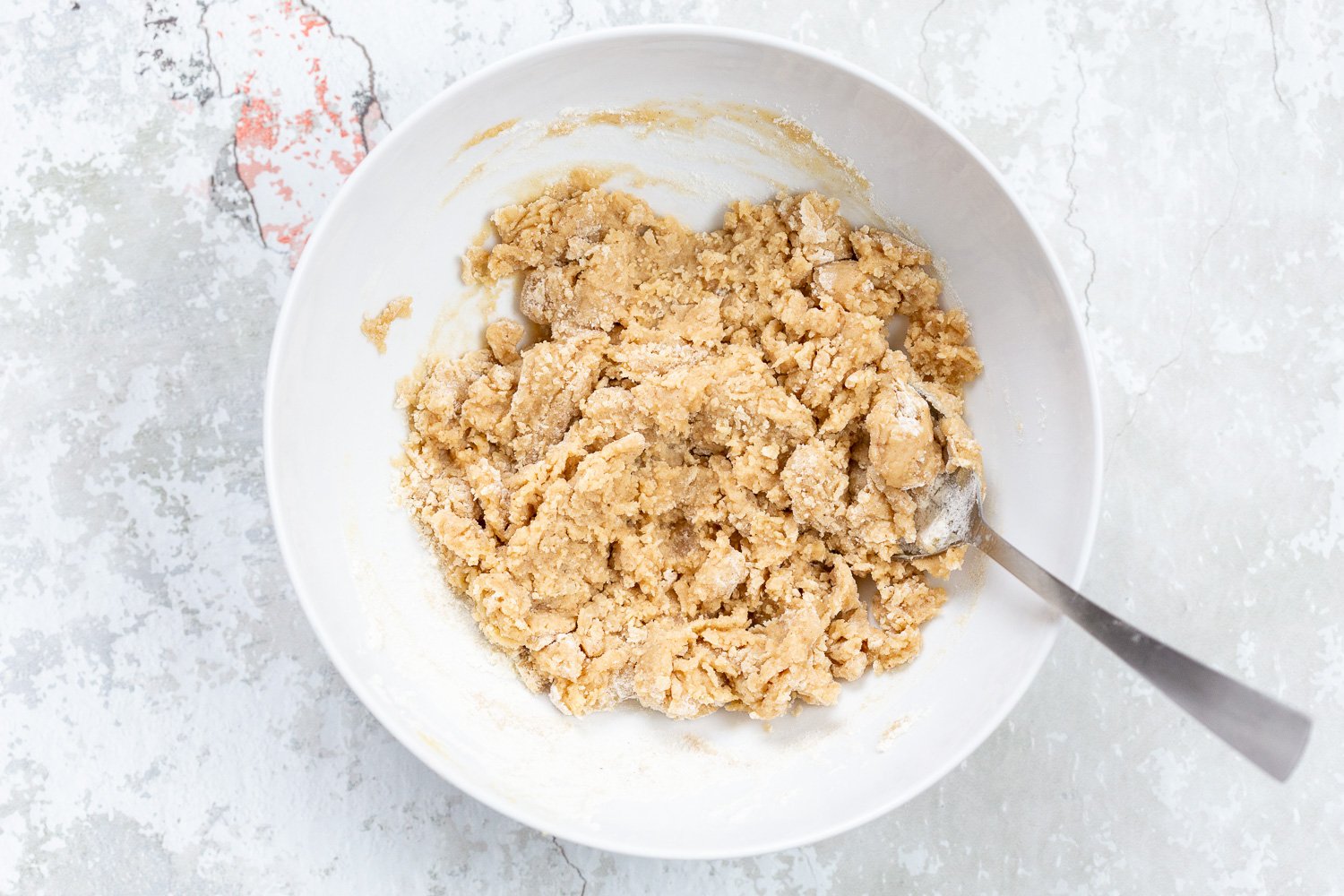 Dough for out Vegan Snickerdoodle Bars in a white bowl