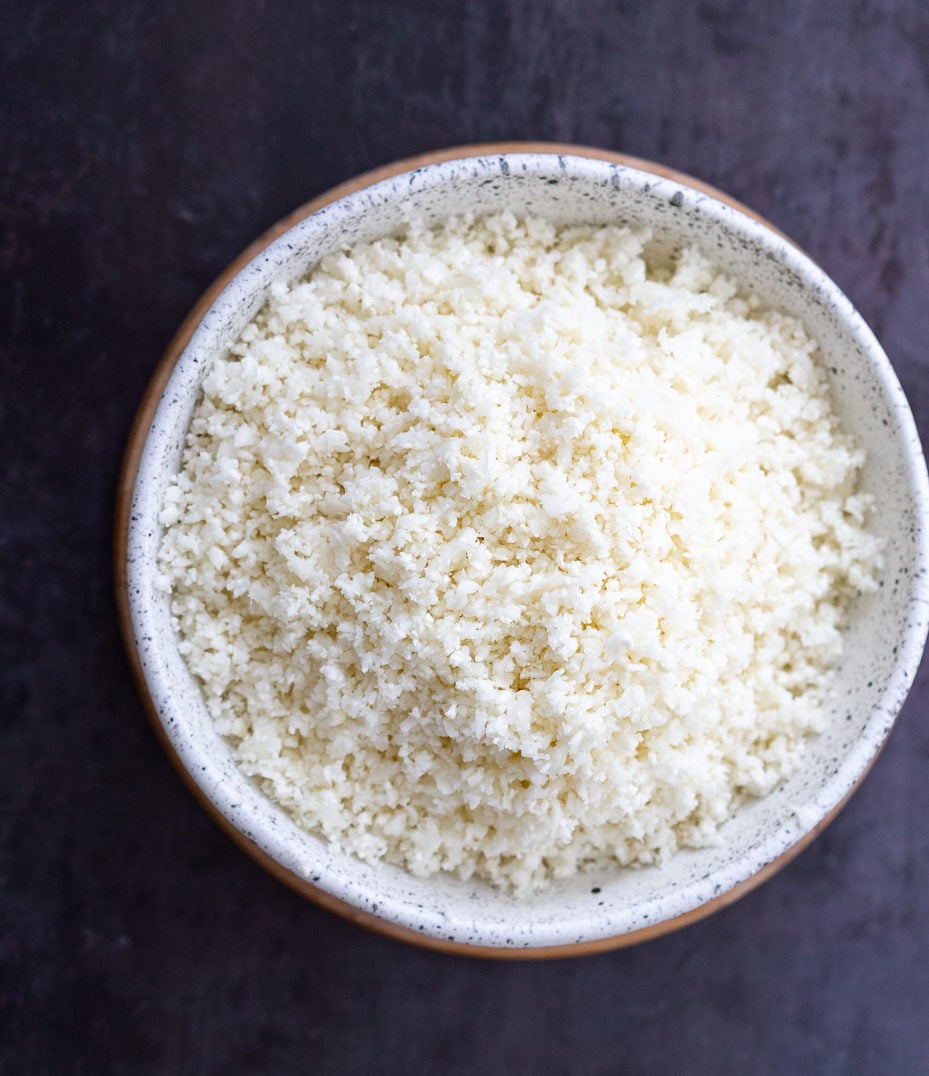 Lemony Turmeric Cauliflower Rice. Easy Side with any meal. 1 Pot Lemon Cauliflower Rice with mustard seeds and garlic. #Vegan #Glutenfree #Grainfree #Nutfree #Recipe #Turmeric #cauliflowerrice #veganrucha