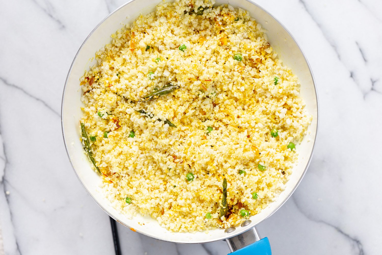 Our Turmeric Cauliflower Rice Process steps in White skillet